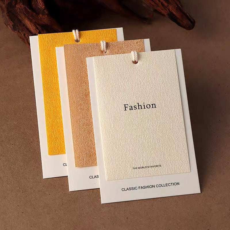 Custom clothing hang tags with textured fronts in three colors