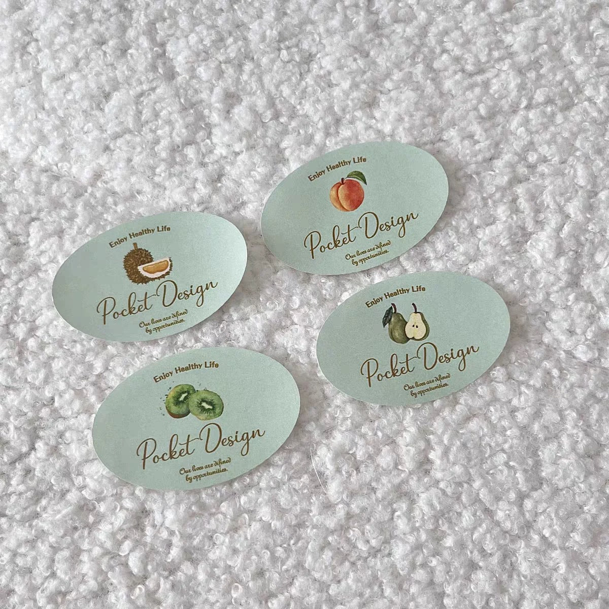 Custom printed coated paper stickers in oval shapes