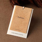 Tan custom clothing hang tag with textured front