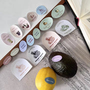 Custom printed coated paper stickers in assorted shapes and colors